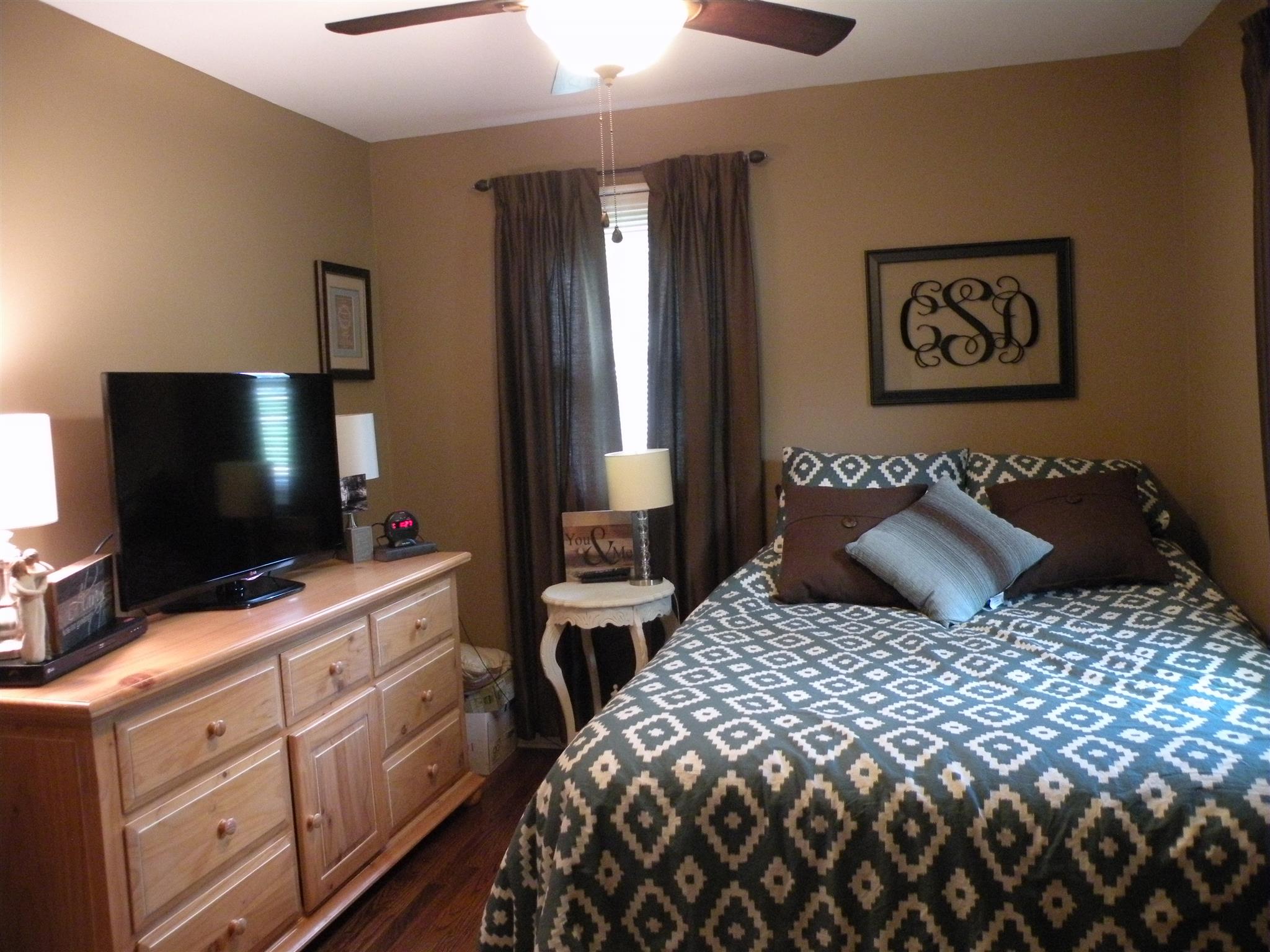 301 Fowler Ford Road Portland, TN 37148 - Photo 13 of 22 a bedroom with a bed and a flat screen tv