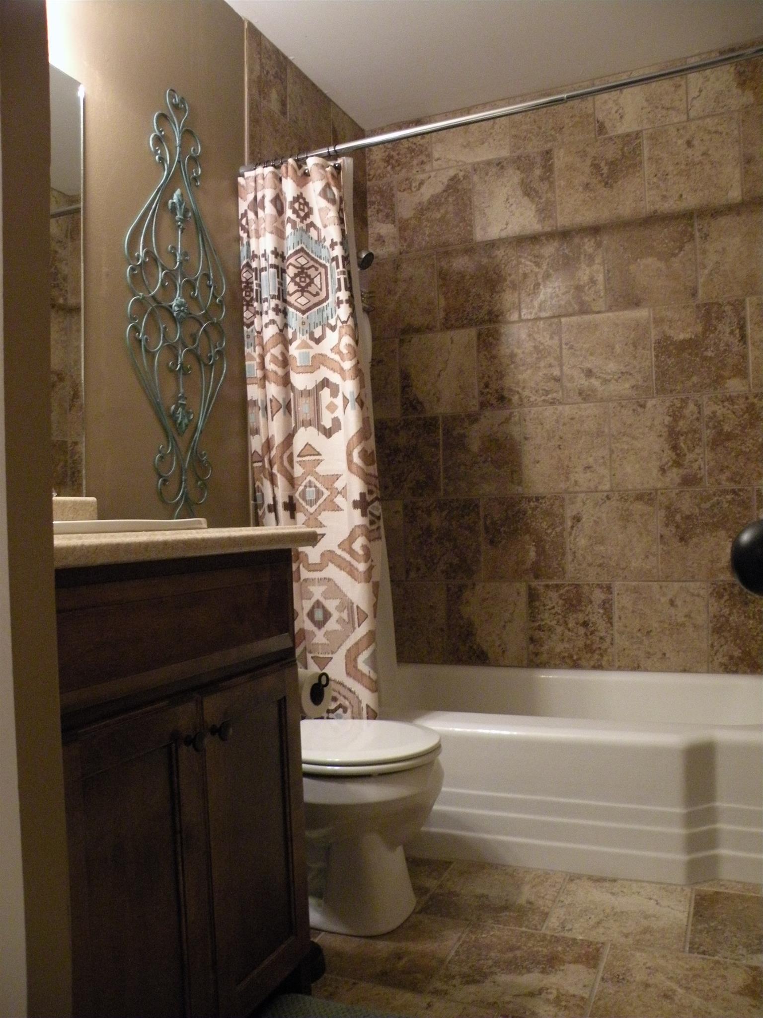 301 Fowler Ford Road Portland, TN 37148 - Photo 18 of 22 a bathroom with a bathtub and shower