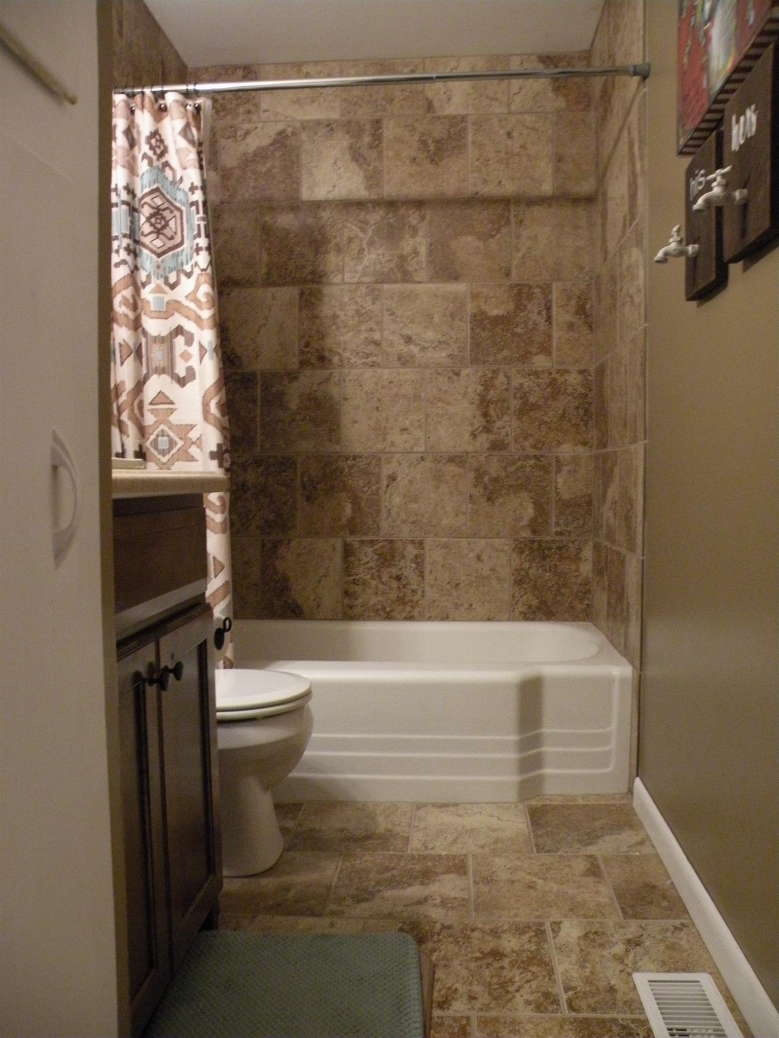 301 Fowler Ford Road Portland, TN 37148 - Photo 19 of 22 a bathroom with a shower and a toilet