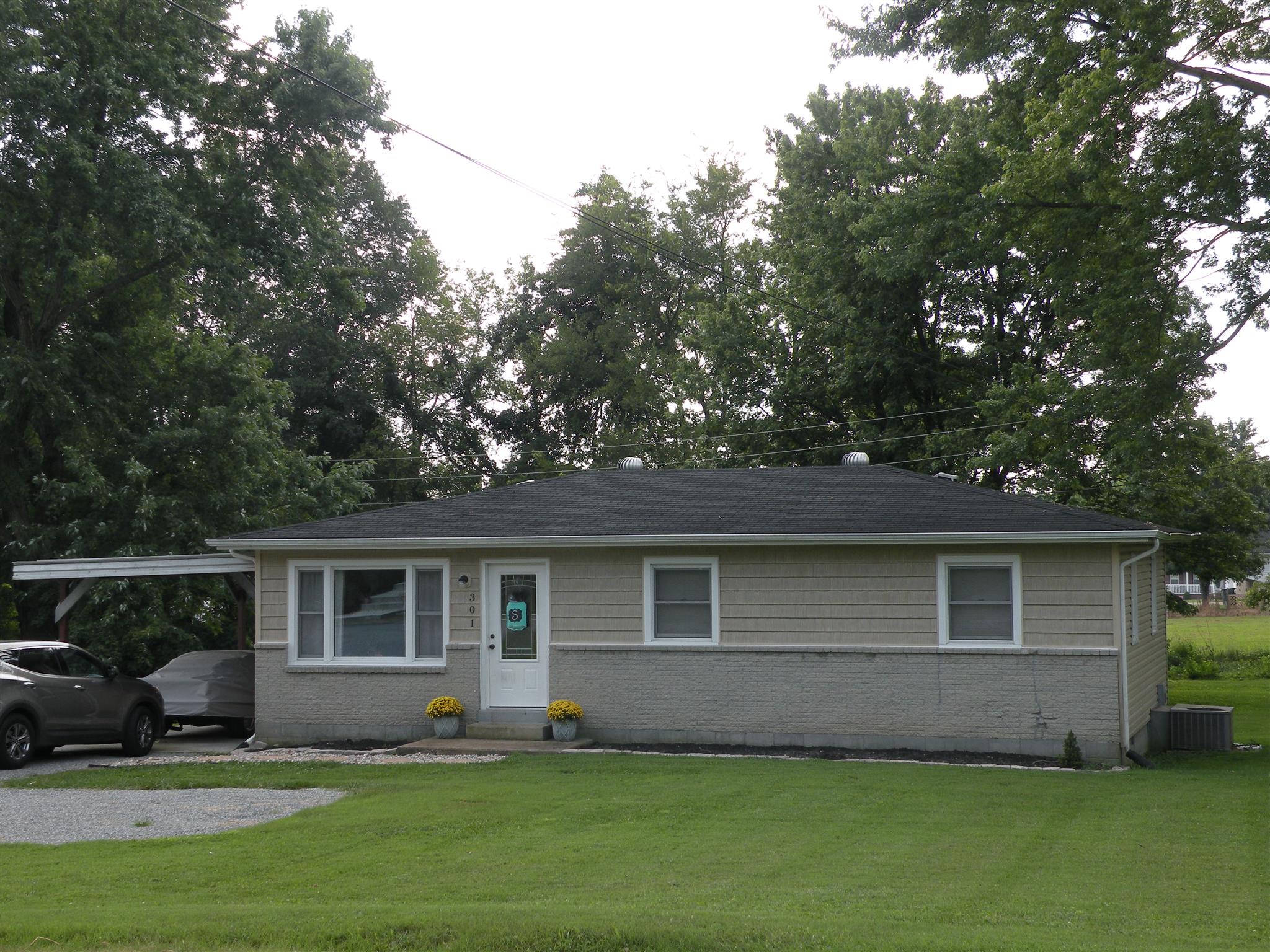 301 Fowler Ford Road Portland, TN 37148 - Photo 3 of 22 a front view of a house with a yard and trees