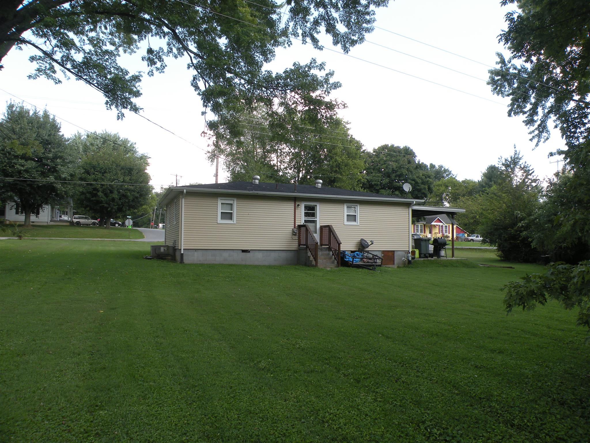 301 Fowler Ford Road Portland, TN 37148 - Photo 22 of 22 a view of a backyard with large trees