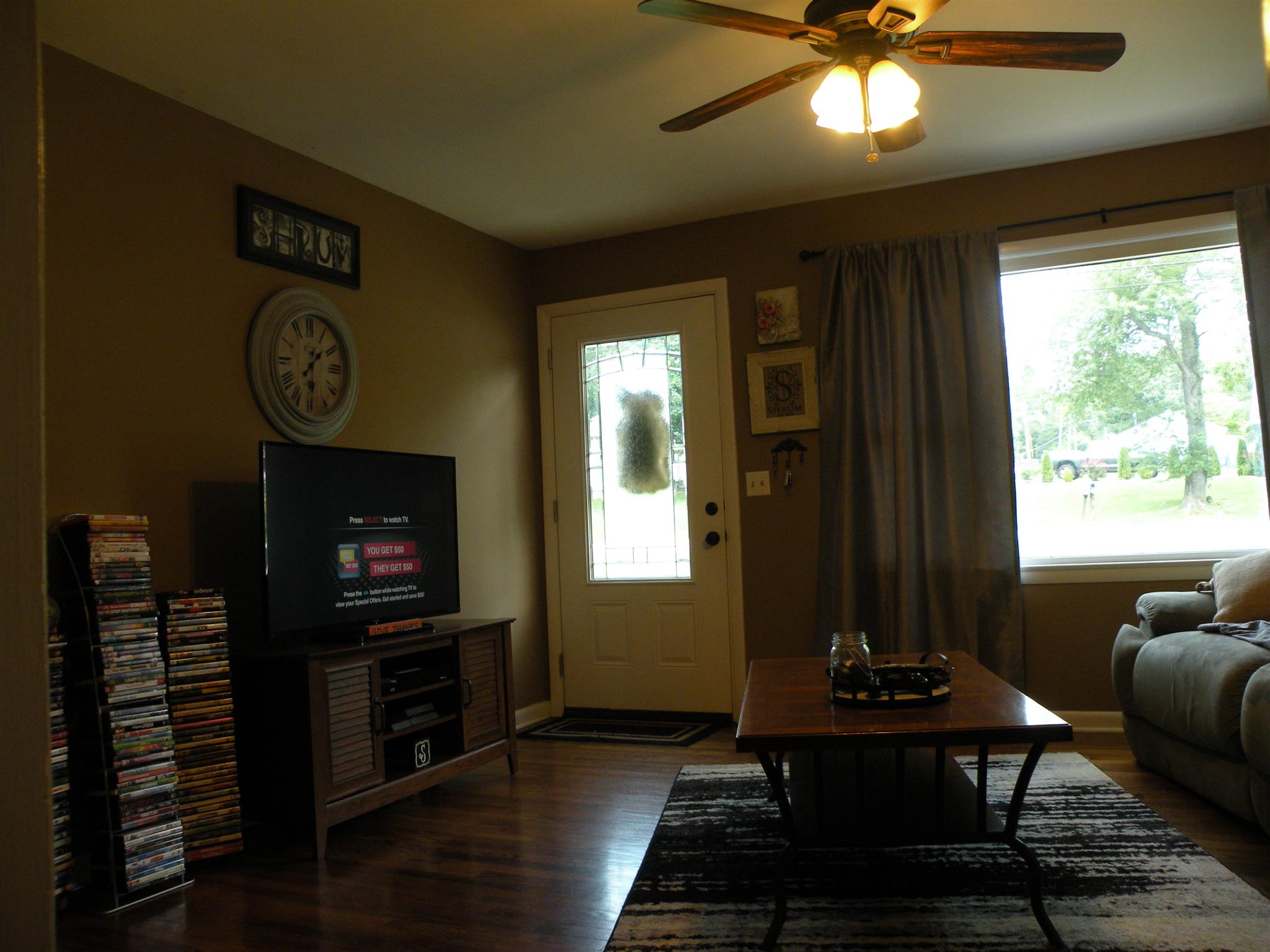 301 Fowler Ford Road Portland, TN 37148 - Photo 4 of 22 a living room with furniture a flat screen tv and a fireplace