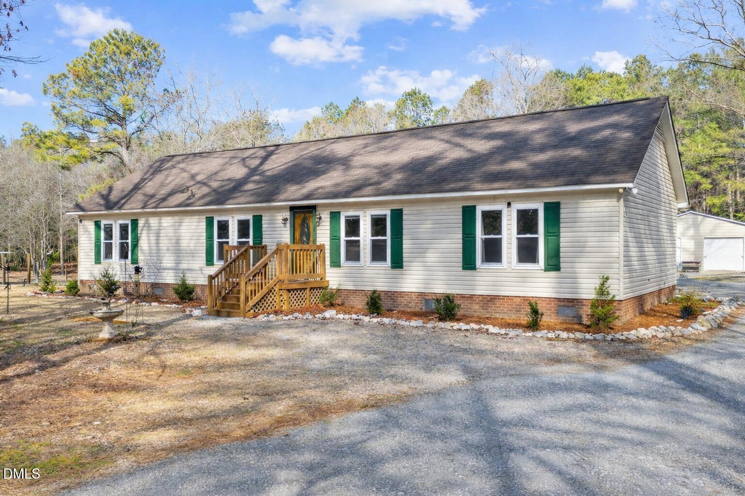 2465 Shoeheel Road Selma, NC 27576 - Photo 1 of 36 a view of a house with a outdoor space