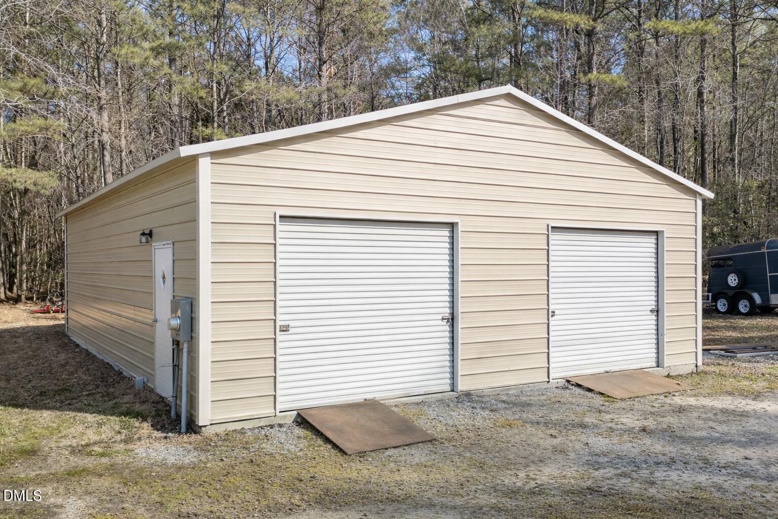 2465 Shoeheel Road Selma, NC 27576 - Photo 25 of 36 a view of a white house with large space