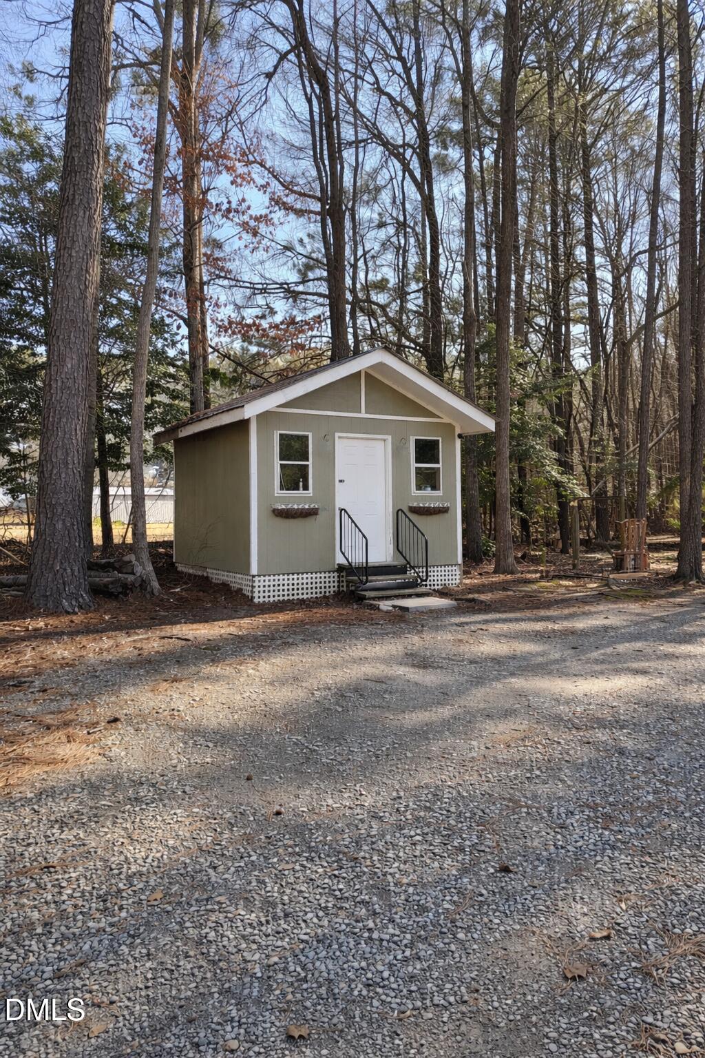 2465 Shoeheel Road Selma, NC 27576 - Photo 26 of 36 a white house that has a tree in front of it