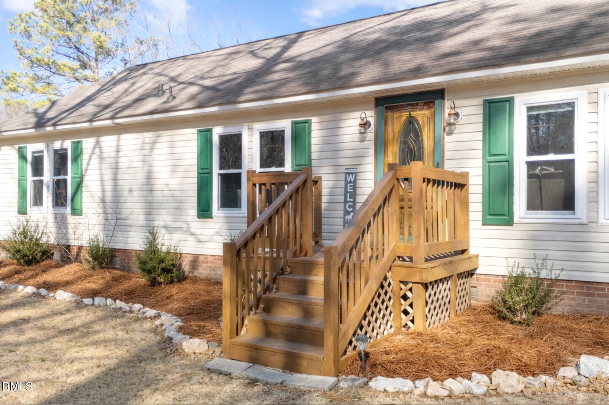 2465 Shoeheel Road Selma, NC 27576 - Photo 2 of 36 a view of wooden house