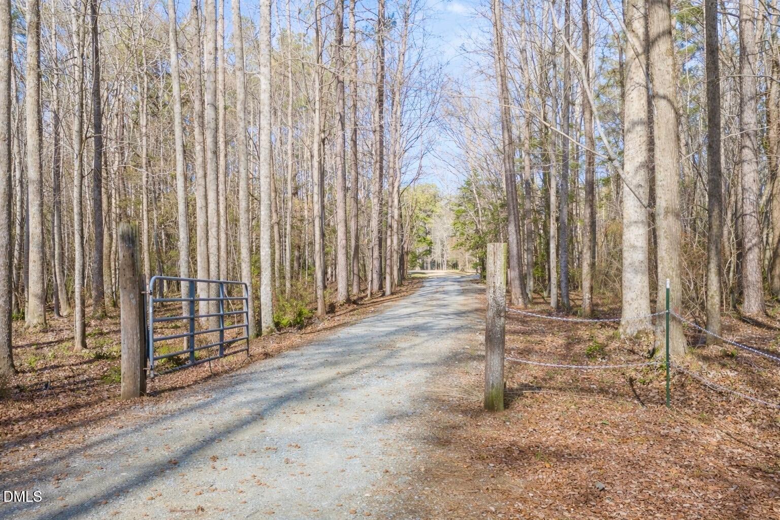 2465 Shoeheel Road Selma, NC 27576 - Photo 32 of 36 a view of a backyard with pathway