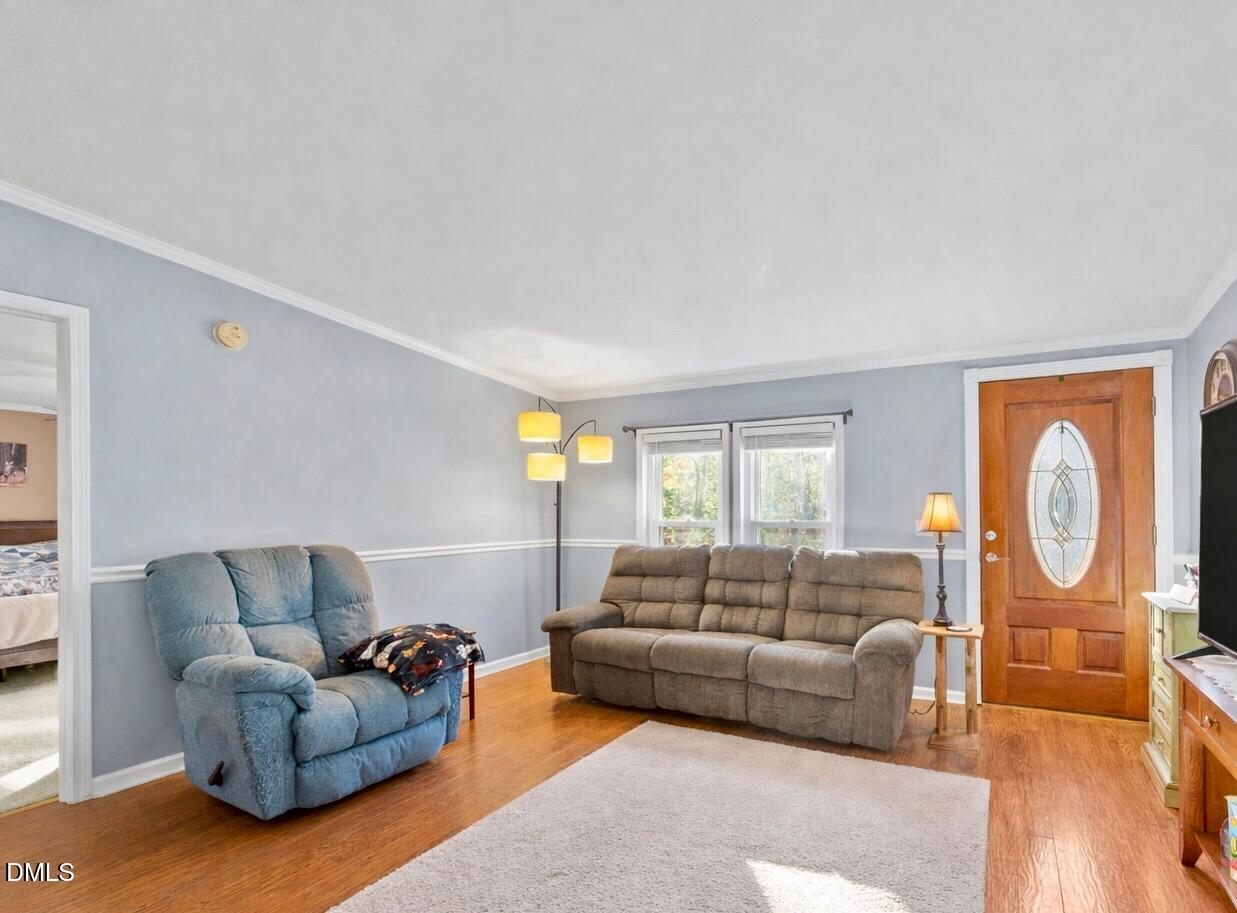 2465 Shoeheel Road Selma, NC 27576 - Photo 3 of 36 a living room with a couch and a window