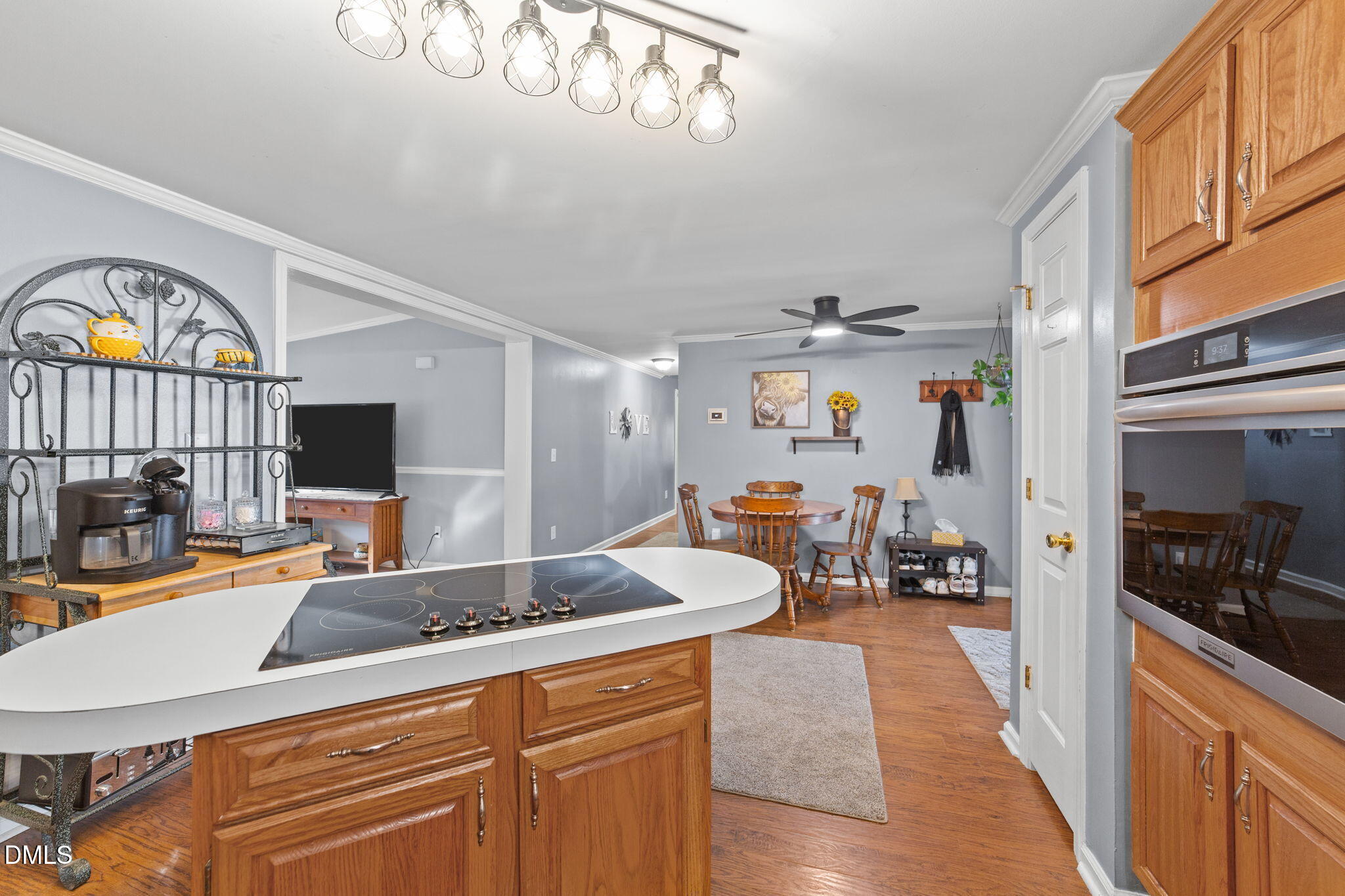2465 Shoeheel Road Selma, NC 27576 - Photo 8 of 36 a kitchen that has a lot of cabinets a sink and a wooden floor