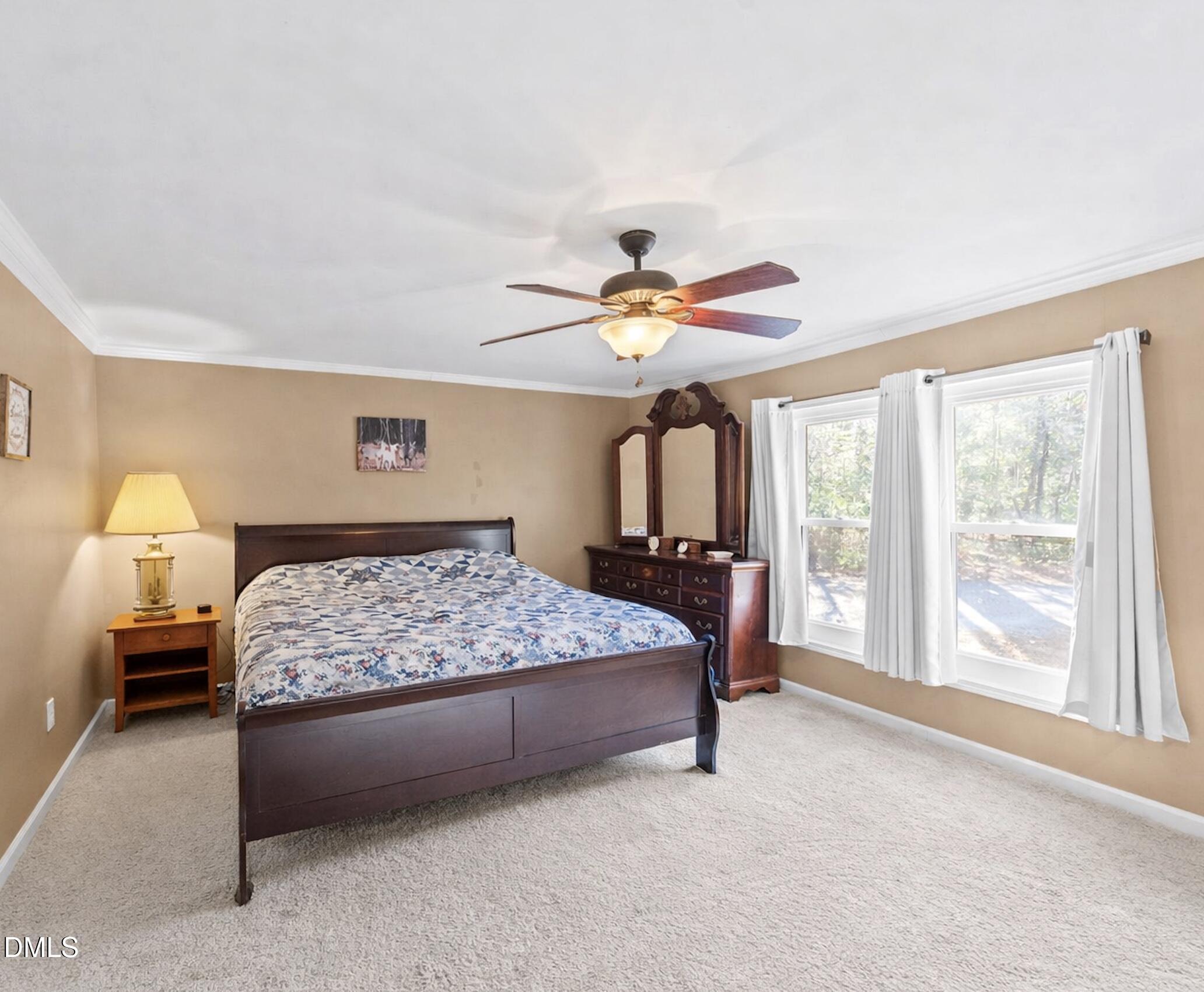 2465 Shoeheel Road Selma, NC 27576 - Photo 9 of 36 a bedroom with a bed and a large window