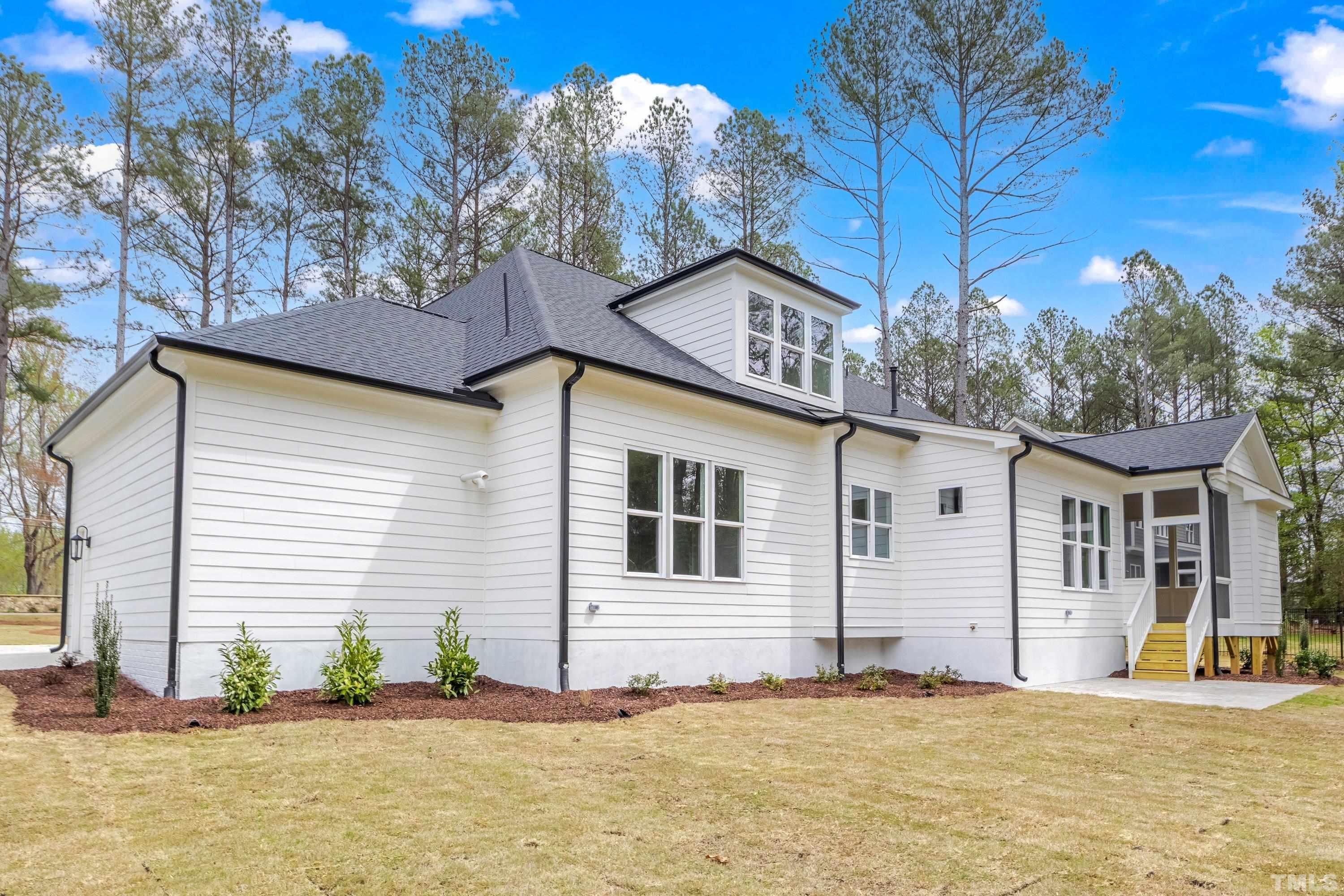 2921 Mt Vernon Church Road Raleigh, NC 27613 - Photo 54 of 57 a front view of a house with a yard