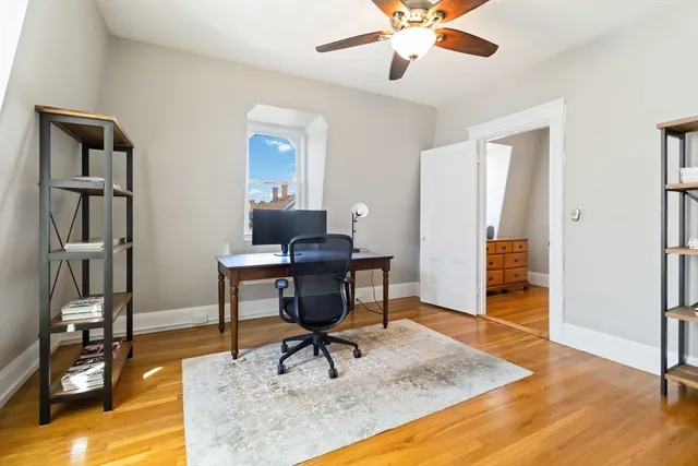 a workspace with wooden floor and a cabinet