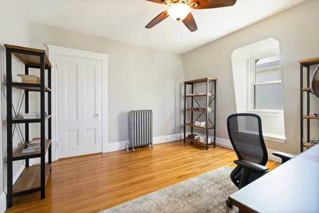 a view of a livingroom with furniture and a workspace