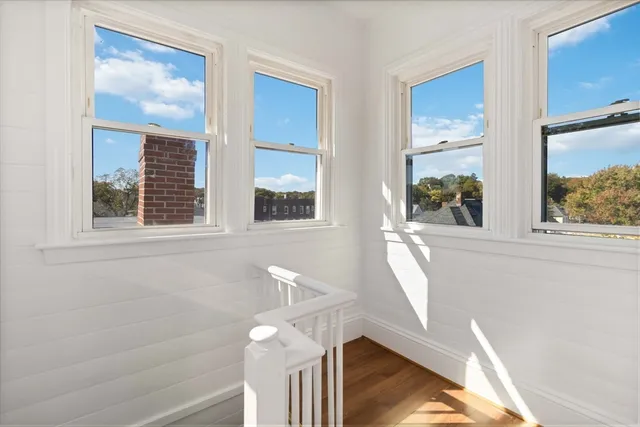 a view of a window with a flower pot