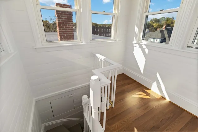 a view of a livingroom with furniture and a window