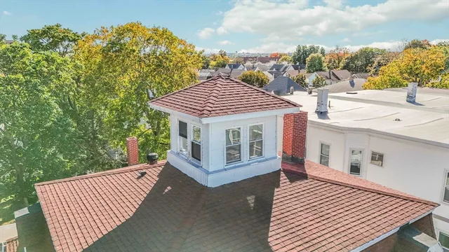 a view of a house with backyard porch and sitting area