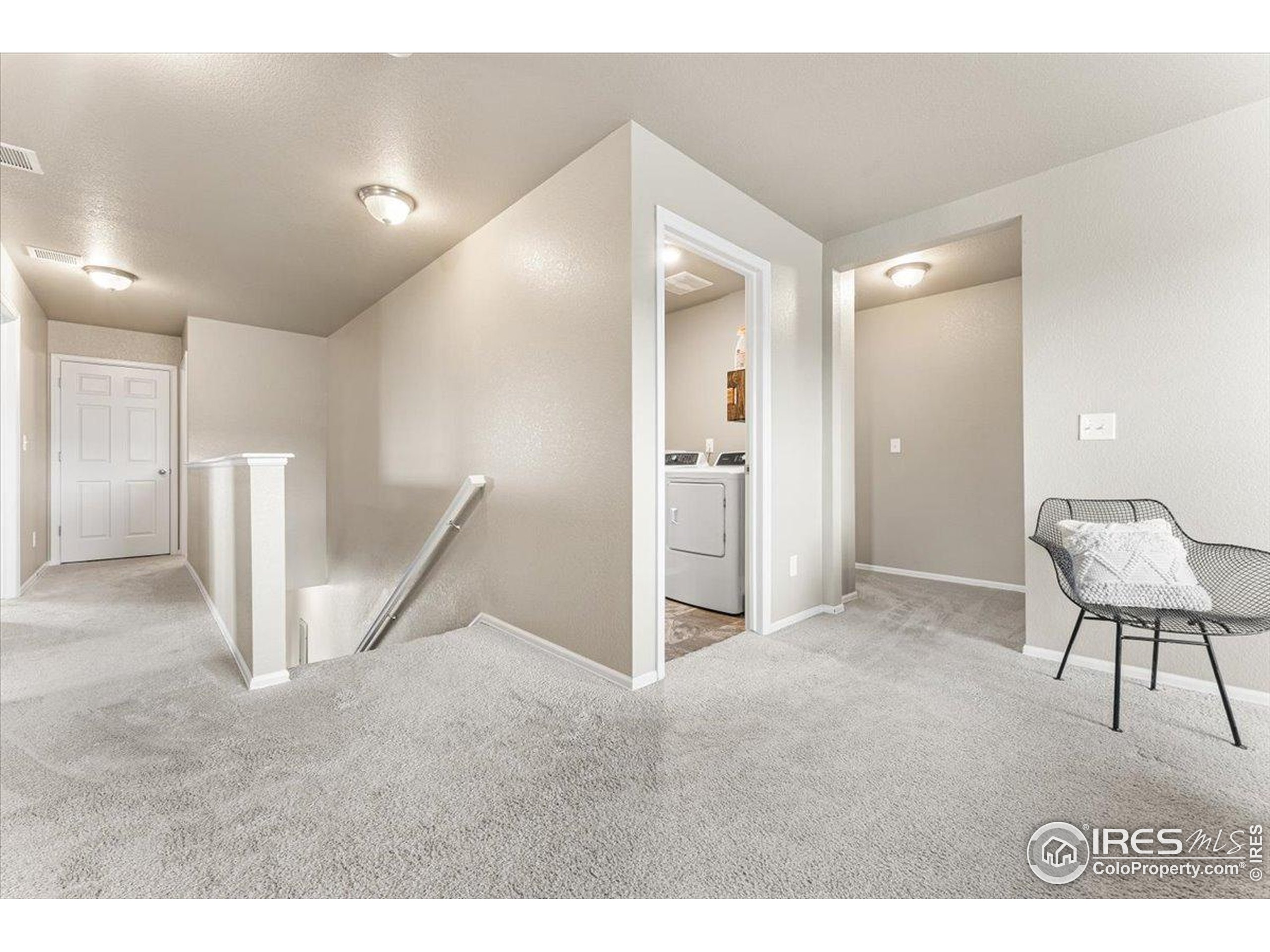 6747 Grainery Road Timnath, CO 80547 - Photo 19 of 42 a view of kitchen with furniture and a refrigerator