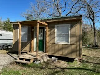 a kitchen with a refrigerator and a sink