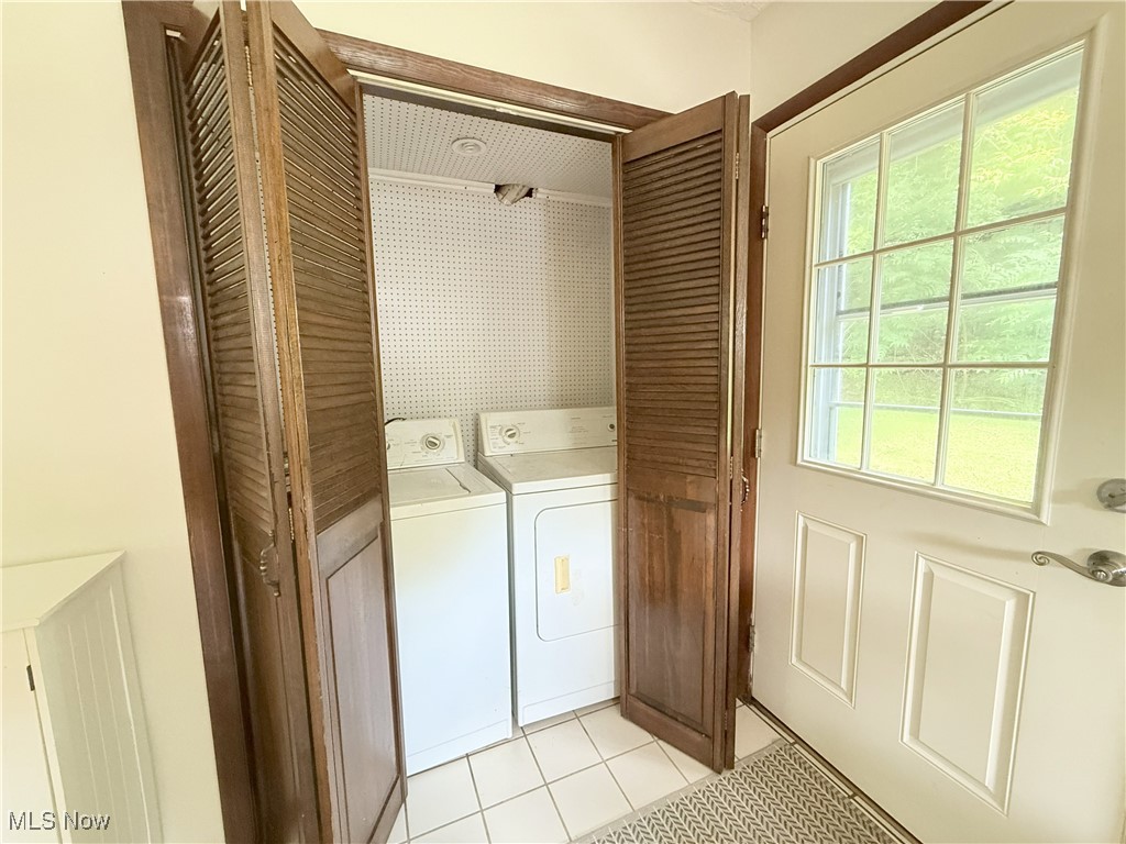 4901 Kings Creek Road Weirton, WV 26062 - Photo 9 of 28 Laundry area with separate washer and dryer and light tile patterned flooring