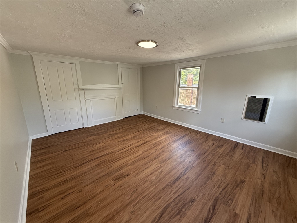 3 Mill Street Shirley, MA 01464 - Photo 13 of 27 an empty room with wooden floor and windows