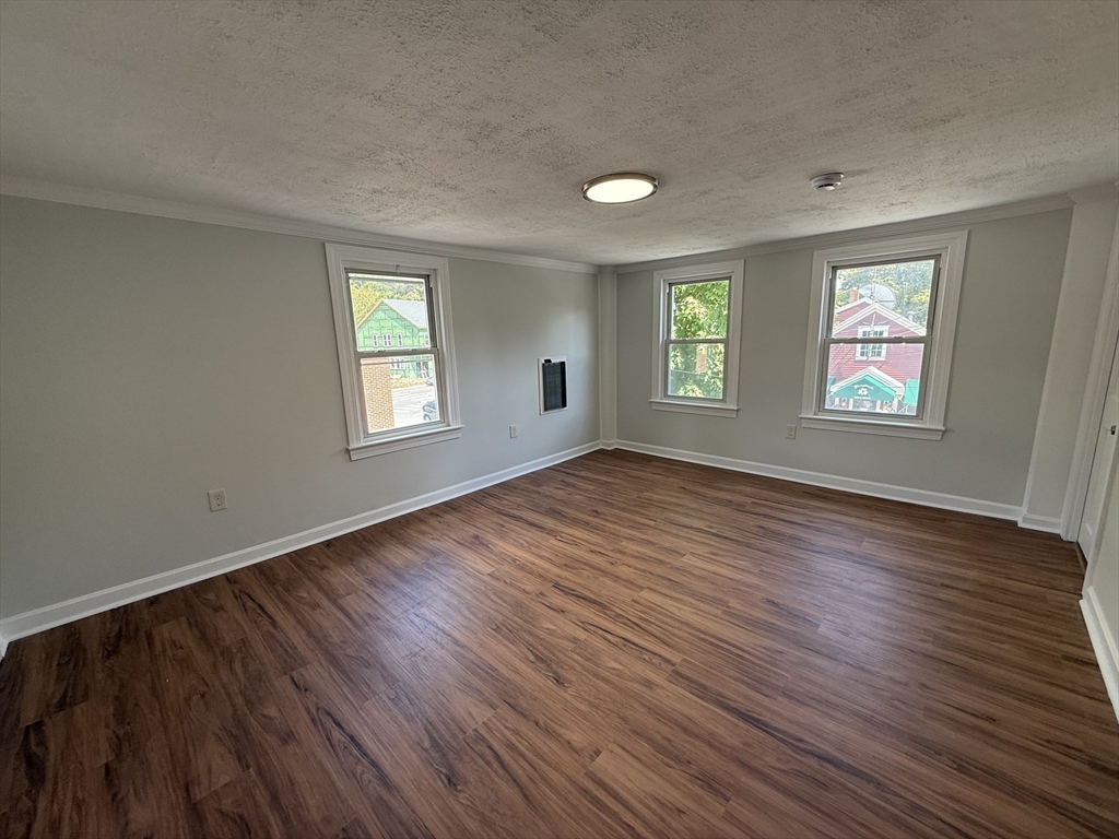 3 Mill Street Shirley, MA 01464 - Photo 14 of 27 a view of empty room with window and wooden floor