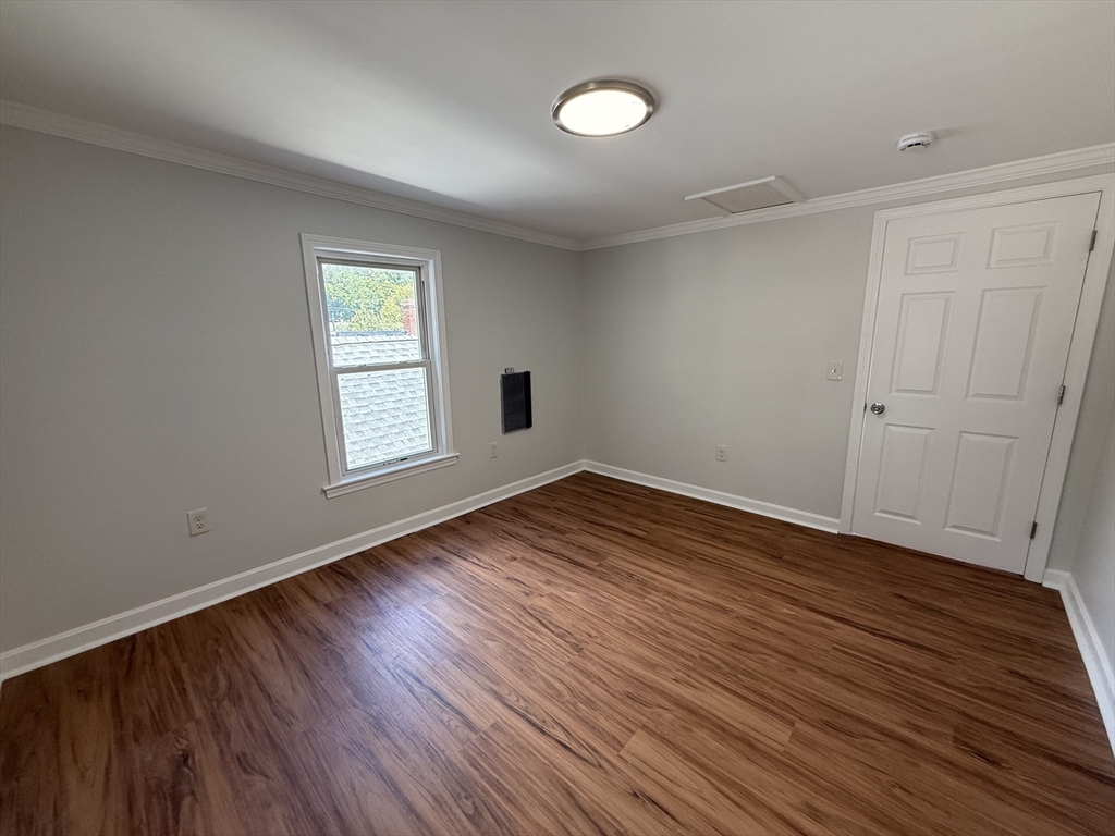 3 Mill Street Shirley, MA 01464 - Photo 15 of 27 an empty room with wooden floor and windows
