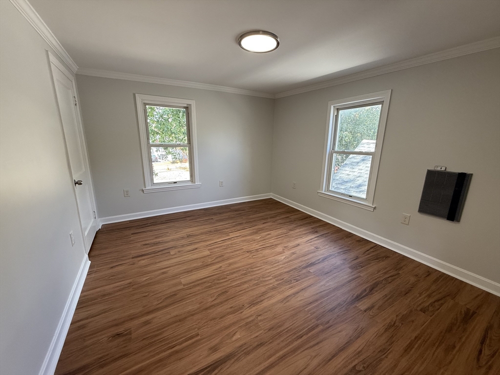 3 Mill Street Shirley, MA 01464 - Photo 16 of 27 a view of an empty room with wooden floor and a window