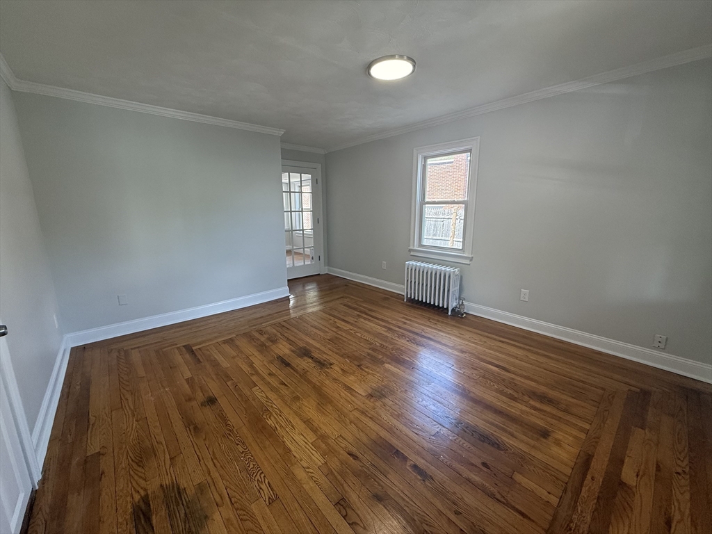3 Mill Street Shirley, MA 01464 - Photo 2 of 27 an empty room with wooden floor and windows