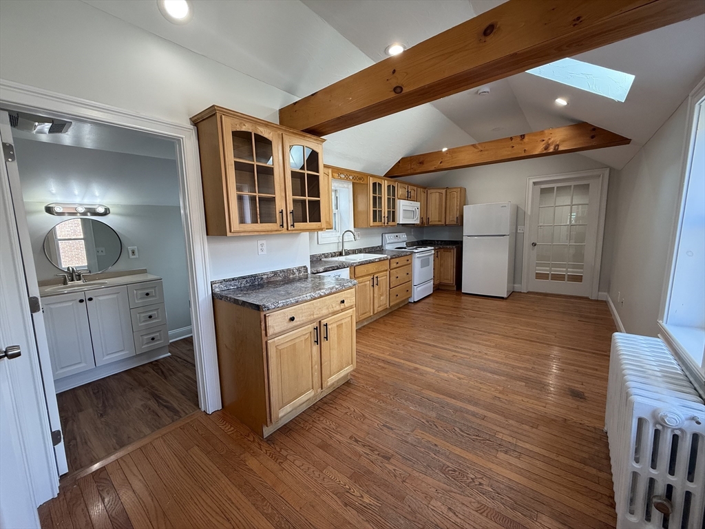 3 Mill Street Shirley, MA 01464 - Photo 8 of 27 a kitchen with stainless steel appliances granite countertop a stove and a refrigerator