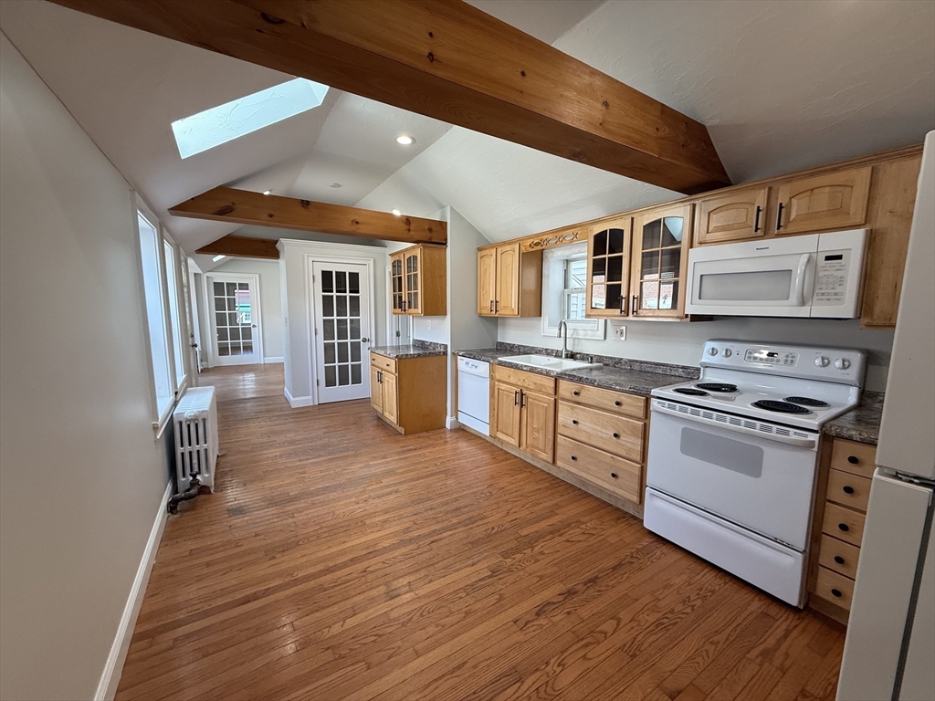 3 Mill Street Shirley, MA 01464 - Photo 10 of 27 a kitchen with stainless steel appliances granite countertop a stove and a refrigerator