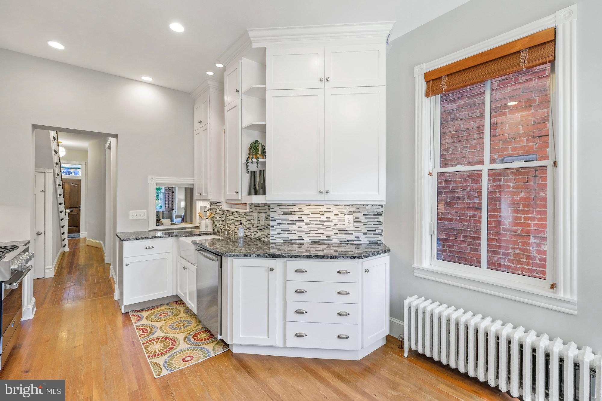 1342 Wallach Place Northwest Washington, DC 20009 - Photo 11 of 36 Kitchen With Original Pass Through Window