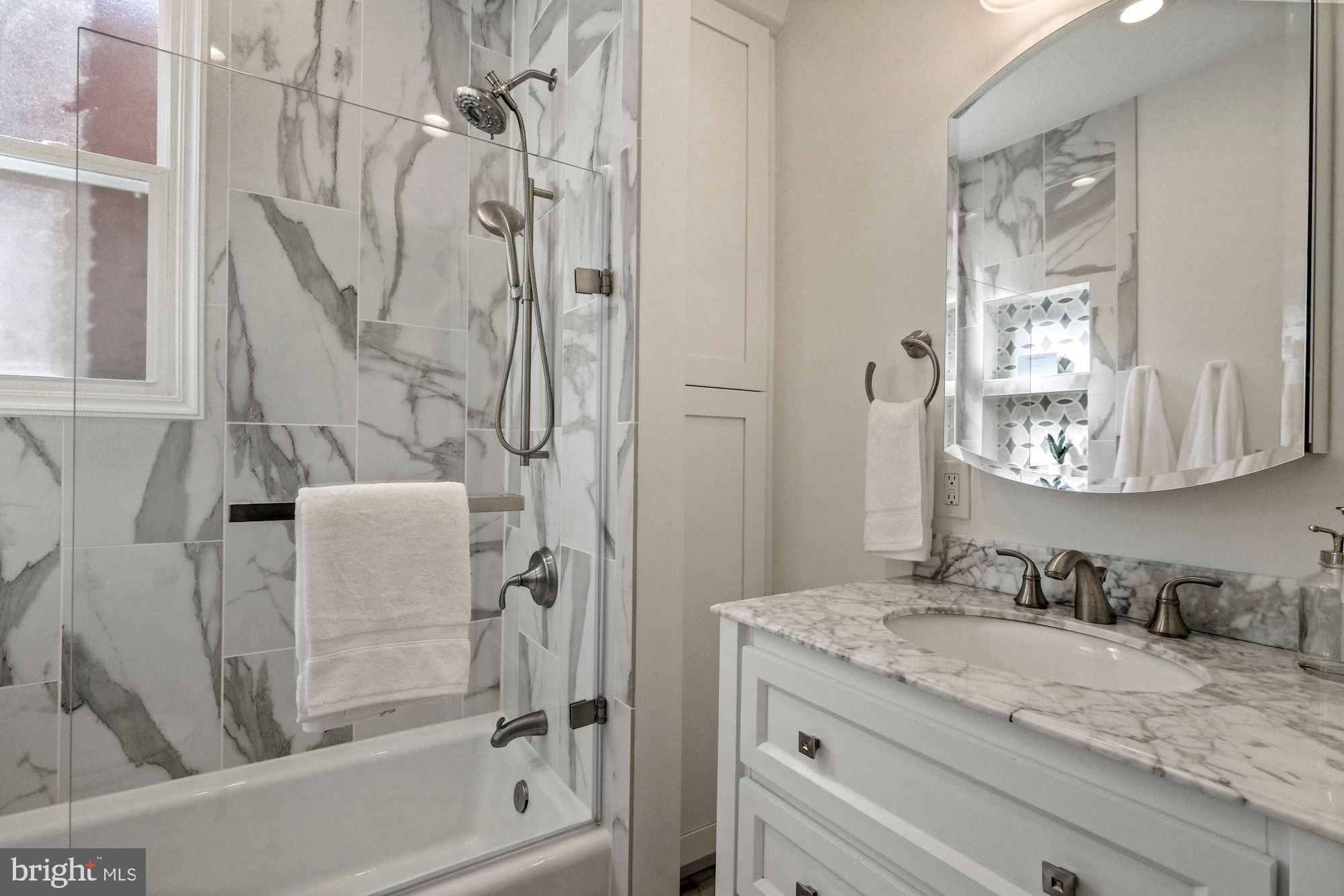 1342 Wallach Place Northwest Washington, DC 20009 - Photo 18 of 36 New Hallway Bathroom With White Marble Look Tile