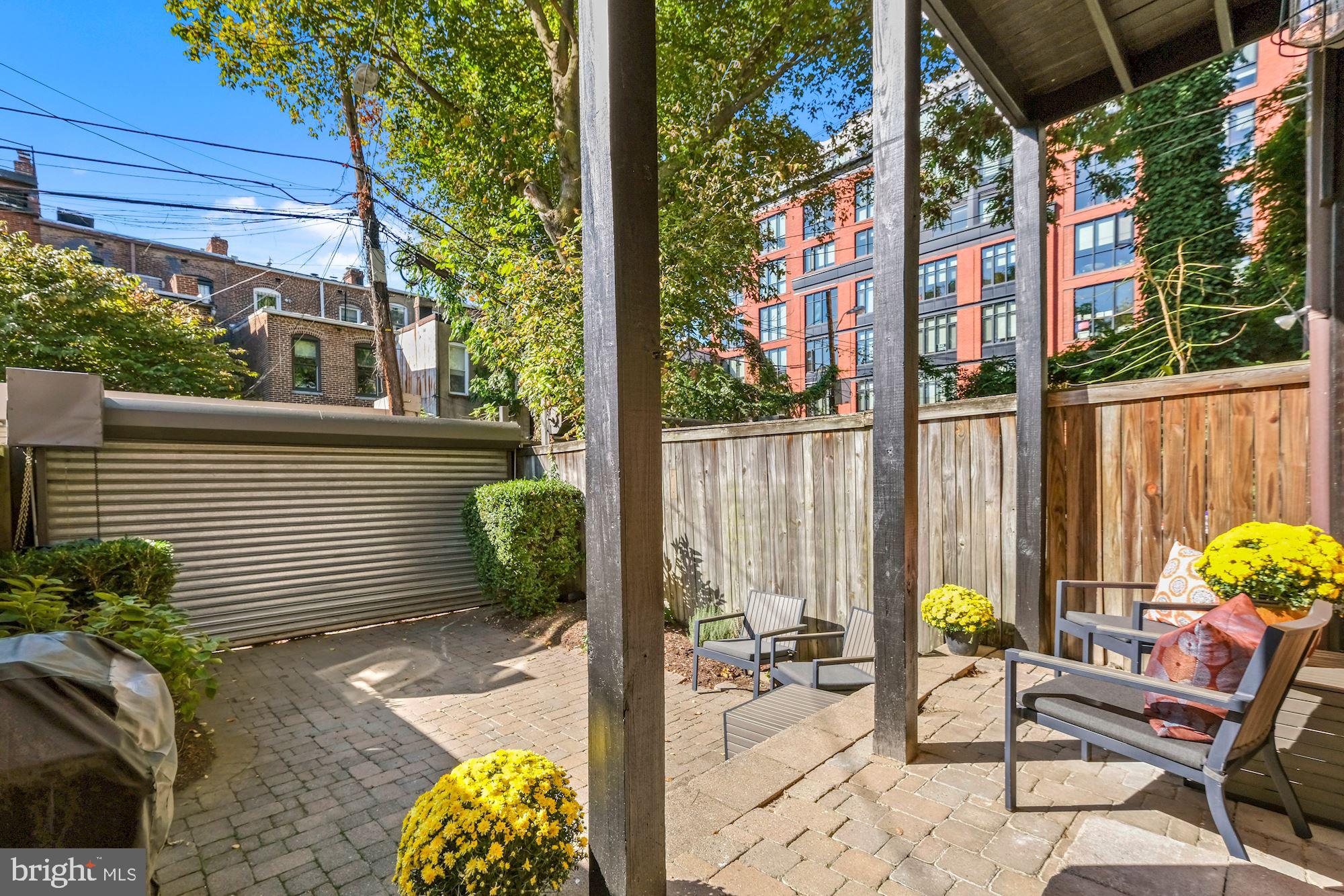 1342 Wallach Place Northwest Washington, DC 20009 - Photo 24 of 36 Backyard With Roll-Up Gate Parking
