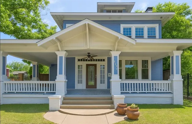 a view of a house with a porch and furniture
