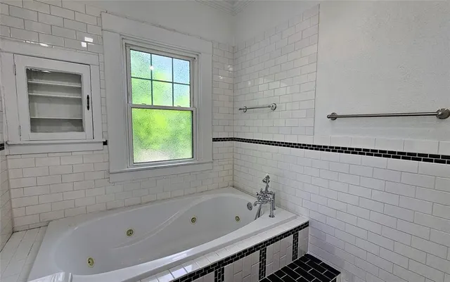 a bathroom with a sink toilet and mirror