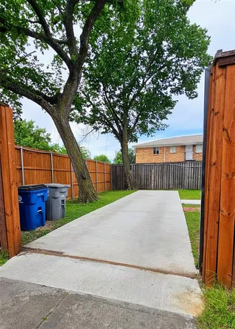 a view of backyard and tree