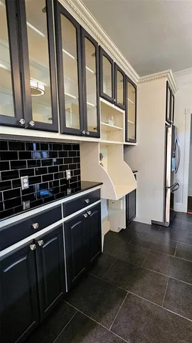 a kitchen with stainless steel appliances a sink stove and cabinets