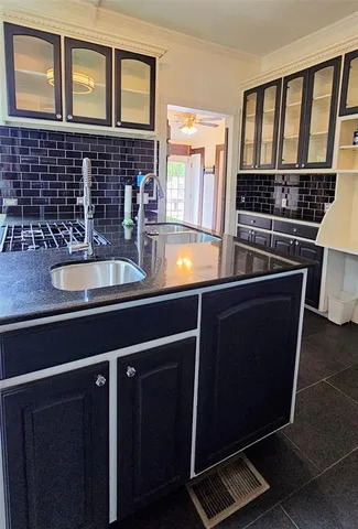 a view of an empty room with a fireplace and a window