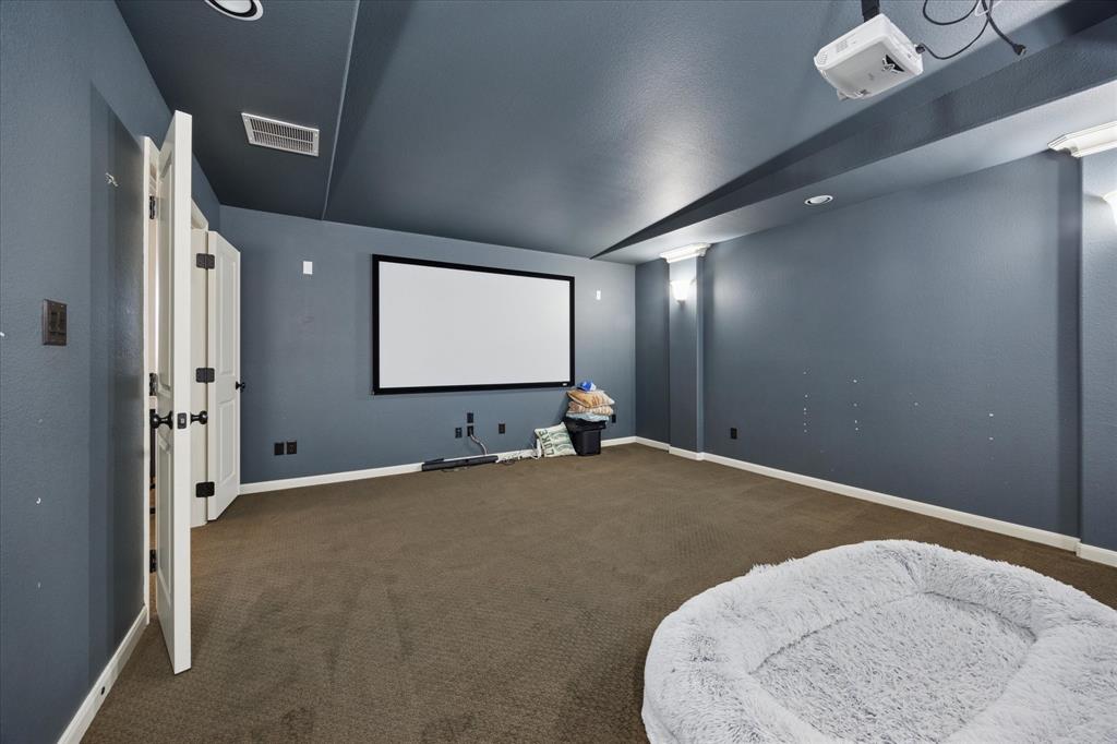 580 Butchart Drive Prosper, TX 75078 - Photo 25 of 40 Carpeted home theater room featuring baseboards