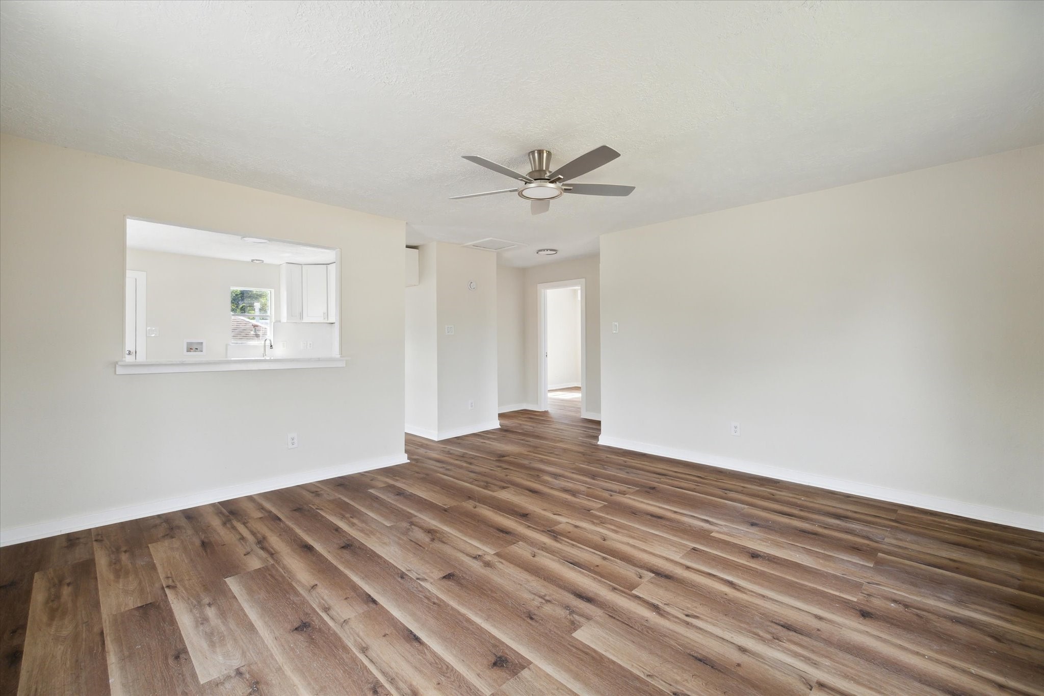 2802 Hardy Street, Unit C Houston, TX 77009 - Photo 14 of 18 a view of empty room with wooden floor