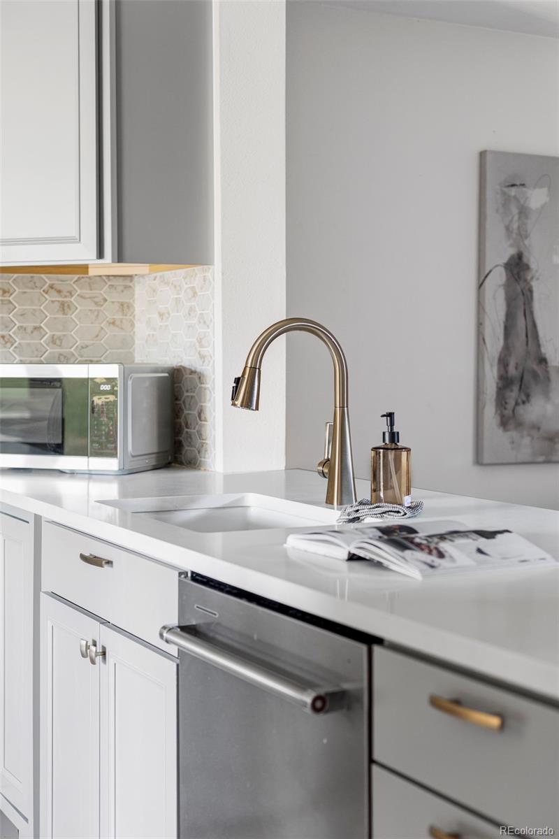 6000 West Mansfield Avenue, Unit 12 Denver, CO 80235 - Photo 13 of 41 a close view of sink and tap