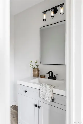a bathroom with a sink and a mirror