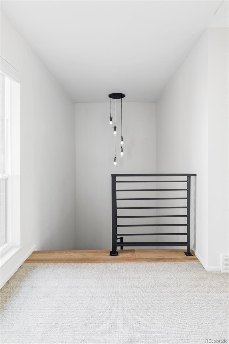 6000 West Mansfield Avenue, Unit 12 Denver, CO 80235 - Photo 18 of 41 a view of an empty room with a window