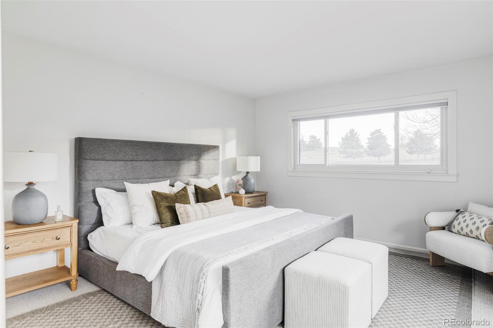 6000 West Mansfield Avenue, Unit 12 Denver, CO 80235 - Photo 19 of 41 a bedroom with bed and a couch