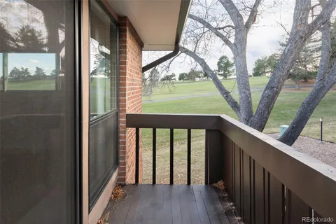 a view of outdoor space with deck and wooden floor