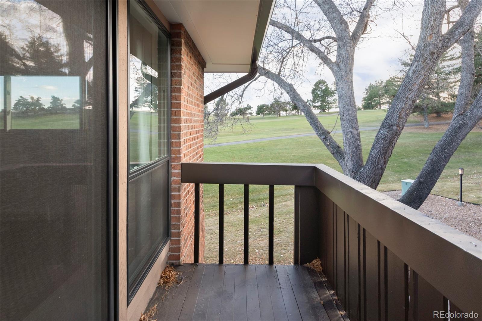 6000 West Mansfield Avenue, Unit 12 Denver, CO 80235 - Photo 21 of 41 a view of outdoor space with deck and wooden floor