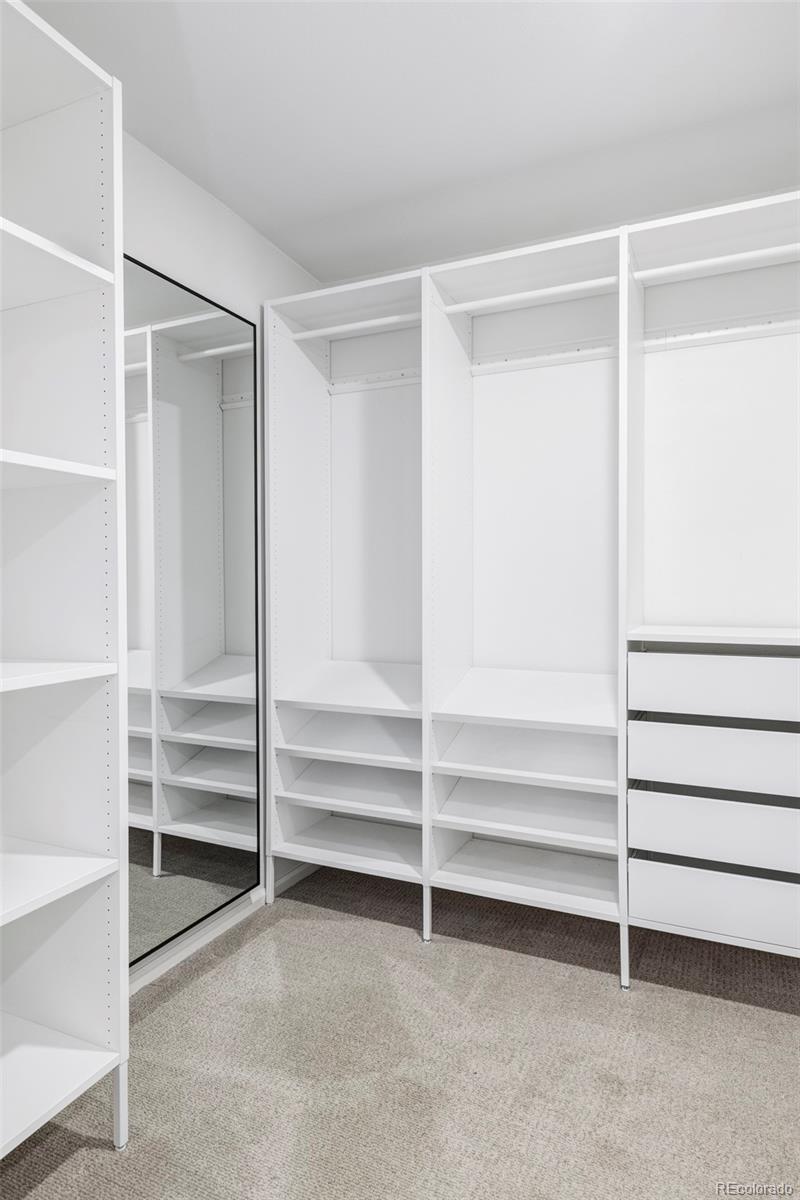 6000 West Mansfield Avenue, Unit 12 Denver, CO 80235 - Photo 24 of 41 a view of walk in closet with empty racks