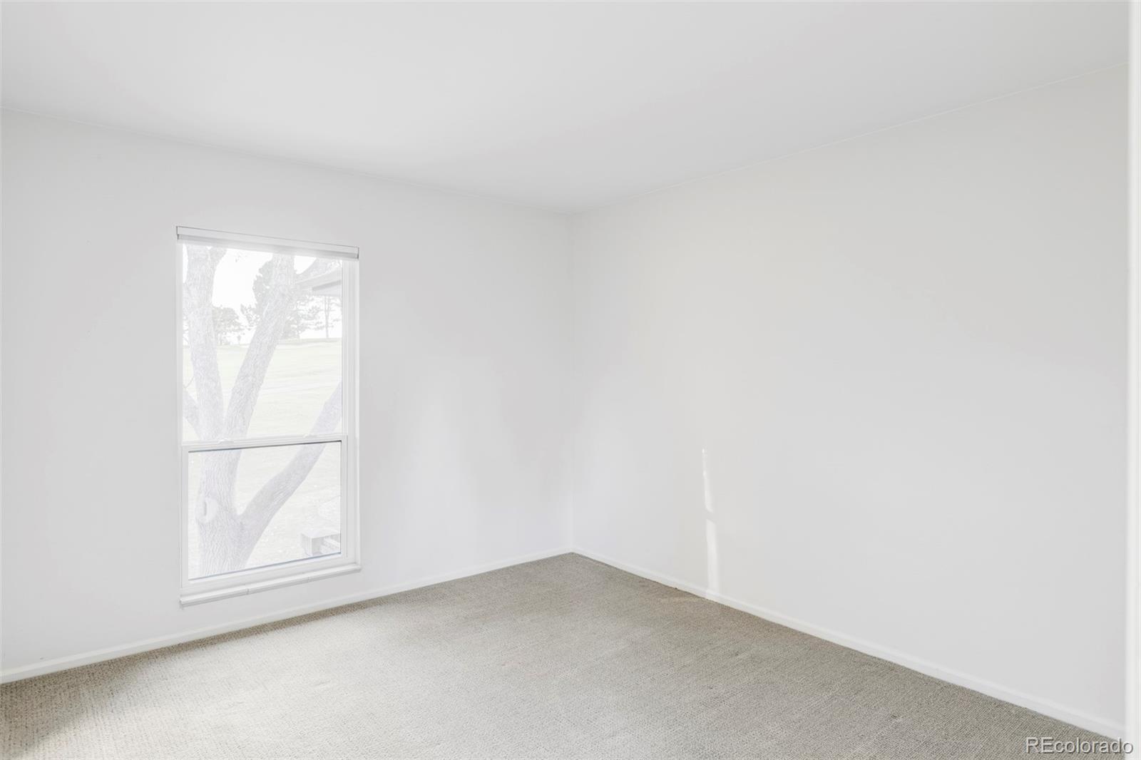 6000 West Mansfield Avenue, Unit 12 Denver, CO 80235 - Photo 25 of 41 an empty room with a window