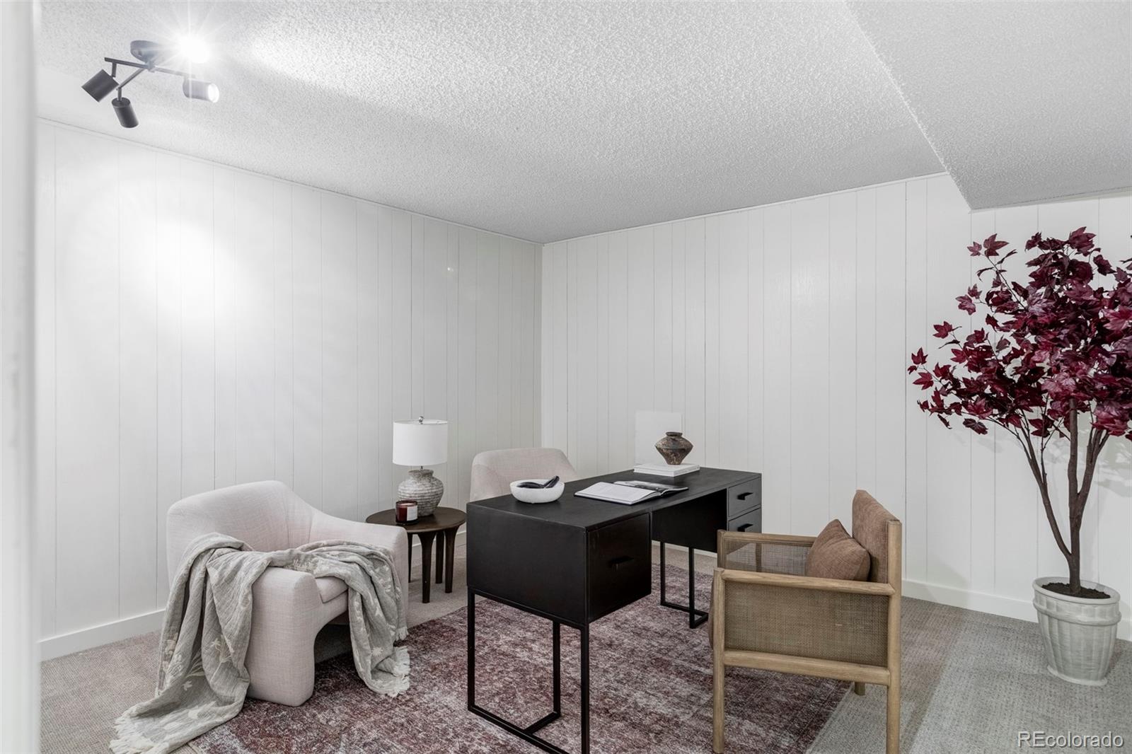 6000 West Mansfield Avenue, Unit 12 Denver, CO 80235 - Photo 27 of 41 a living room with furniture and flowers