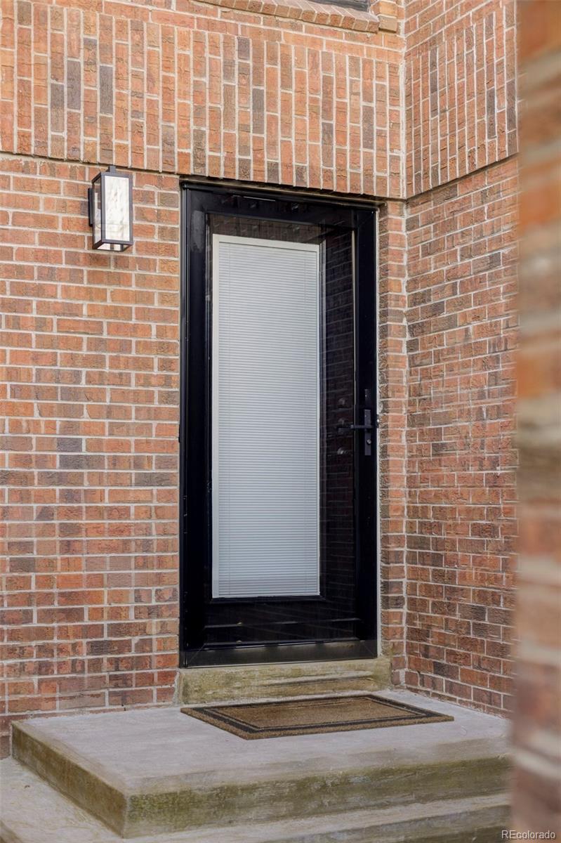 6000 West Mansfield Avenue, Unit 12 Denver, CO 80235 - Photo 3 of 41 a view of entrance